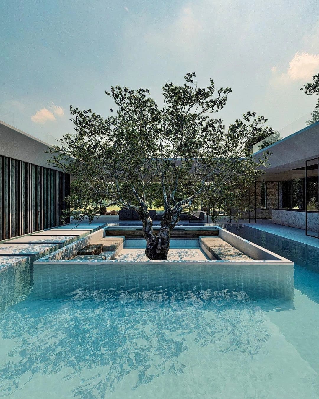 Piscina e árvore junto aos ambientes envidraçados.